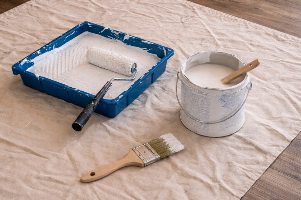 Painting will sometimes trap odors in holding them and only releasing them when the humidity is high.